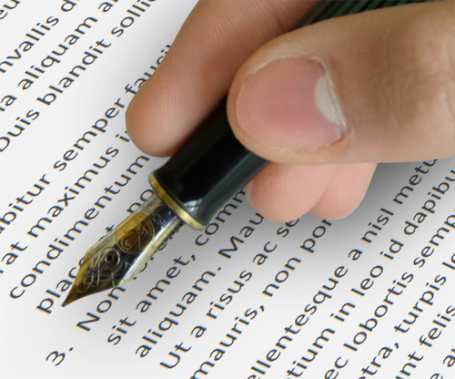 Hand signing a legal document